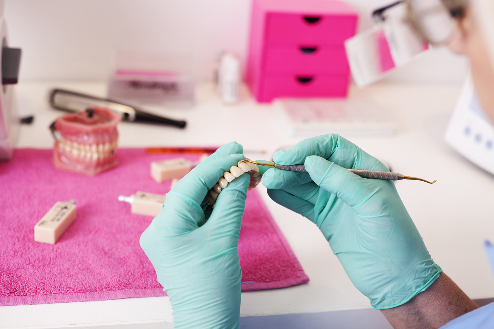 Dental technician working on a tooth crown